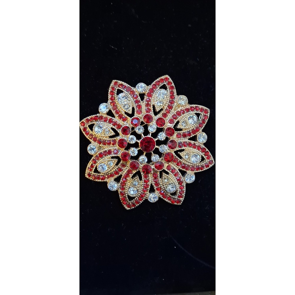 Monet Poinsettia brooch, featuring red and clear rhinestones